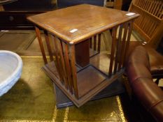 An Edwardian mahogany and inlaid table top revolving book case
