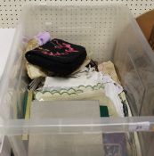 A box of assorted textiles to include a Lulu Guiness handbag,