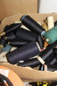 Five boxes containing various yarns, some on wooden bobbins,