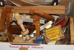 A box containing various violin and guitar making tools including saws, chisels, spares, etc,