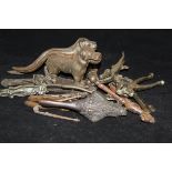 A collection of 14 nutcrackers, two in the form of dogs stamped "Made in England,