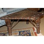 An Eastern hardwood iron bound coffee table of truncated trapezoidal form,