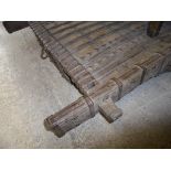 An Indian hardwood iron bound rectangular table of slightly arched form