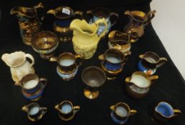 A collection of 14 Victorian copper lustre jugs, a similar small goblet and bowl,