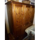 A 20th Century pine triple wardrobe