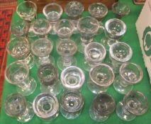 A collection of 25 19th Century and other penny lick glasses