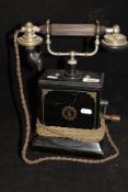 An Ericson Telephones Limited telephone together with two sheepskin coats and one other