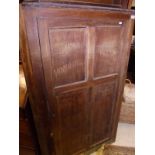 A 19th Century oak corner cabinet with single panelled door,