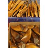 A box of wooden shoe lasts and a box of wooden coathangers
