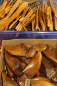 A box of wooden shoe lasts and a box of wooden coathangers