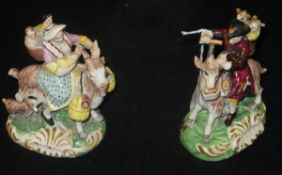 A pair of Victorian polychrome decorated pottery figures of "The Welsh Tailor" and "His Wife",