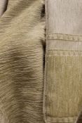 A large pair of beige ground striped lined curtains,