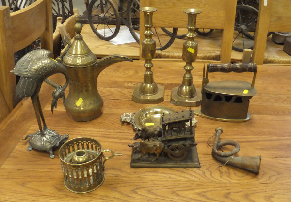 A box of various brassware to include iron chamberstick, pair of candlesticks, Turkish coffee pot,