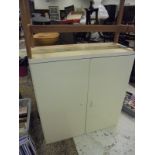 A modern Ikea two door cabinet with mahogany base
