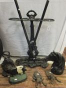 A Victorian style cast iron stick stand, wrought iron fire basket, pair of fire dogs,
