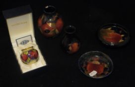 A Moorcroft copper enamel "Pomegranate" miniature vase (boxed),