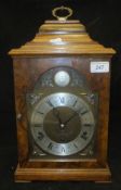 A modern walnut cased mantle clock,