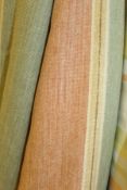 A pair of interlined curtains of peach and green striped design and a matching pelmet,