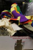 A box of assorted textiles to include a vintage felt harlequin costume,