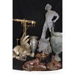 A collection of various metal wares to include Spelter Fisherman, Spelter vase, wine pourer,