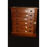 A Victorian stained pine Wellington type table top chest of six drawers CONDITION