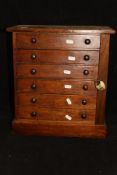 A Victorian stained pine Wellington type table top chest of six drawers CONDITION