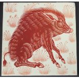 William de Morgan glazed pottery tile, decorated in ruby lustre with a seated wild boar,