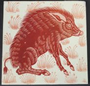 William de Morgan glazed pottery tile, decorated in ruby lustre with a seated wild boar,