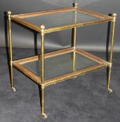 A 19th Century lacquered brass étagère with replacement bevel edged glazed panels,
