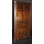 A 19th Century oak corner cupboard with two fielded panel doors enclosing three shelves over two