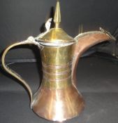 A 19th Century Turkish copper and brass coffee pot with tapering brass finial and cylindrical brass