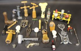 A collection of various corkscrews including novelty corkscrews and Magic Lever cork drawer,