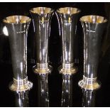 A set of four modern silver stem vases of plain form with tapered rim and banded decoration to base