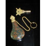 A 19th Century serpentine scent bottle of powder flask form, with gilded stopper and chain, 7.