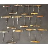 A collection of various 19th Century wooden handled corkscrews various, fifteen with brushes,