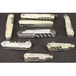 A collection of mother of pearl cased pocket knives,