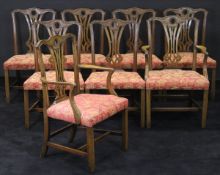 A set of eight 19th Century mahogany dining chairs in the Chippendale taste with over-stuffed seats