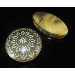 A 19th Century horn circular lidded box, the lid set with ivory roundels and wirework pattern,