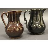 An 18th Century Jackfield black glazed pottery baluster shaped jug with scroll work handle,