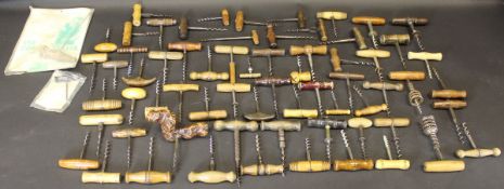 A collection of sixty-five various 19th Century and later wooden handled corkscrews (60)