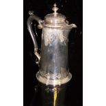 A water jug with engraved decoration depicting Classical head within various swags,