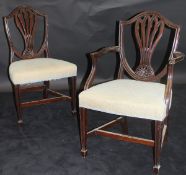 A set of twelve 19th Century Hepplewhite style mahogany shield back dining chairs,