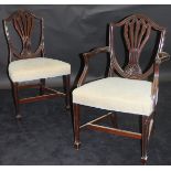 A set of twelve 19th Century Hepplewhite style mahogany shield back dining chairs,