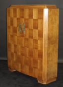 A 1920's Art Deco French walnut cabinet by Dominique of Paris,