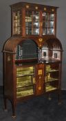 An Edwardian display cabinet by Maple & Co,