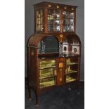 An Edwardian display cabinet by Maple & Co,