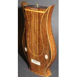 A 19th Century rosewood and mother of pearl inlaid lyre shaped box opening to reveal a fitted