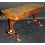 A William IV rosewood library table with tooled and gilded leather insert top above two freize