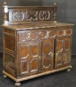 A 19th Century oak cupboard in the 17th Century Jacobean manner,