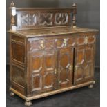 A 19th Century oak cupboard in the 17th Century Jacobean manner,